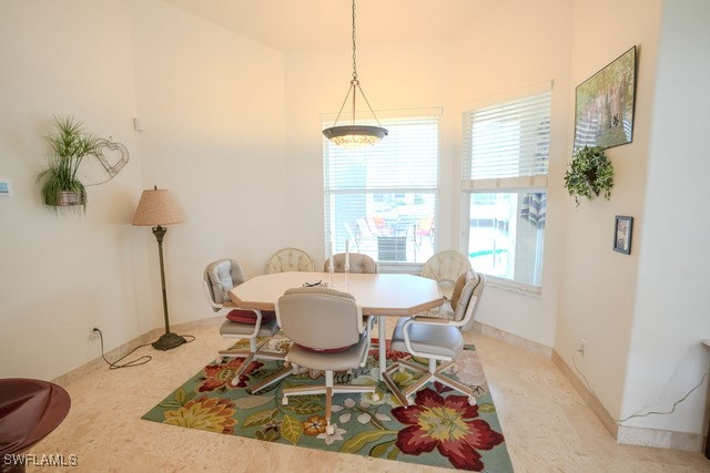 dining area featuring light colored carpet