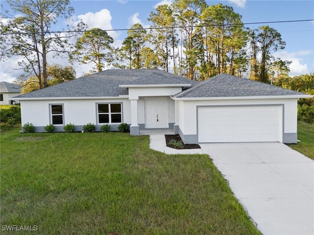 view of front facade with a garage and a front yard