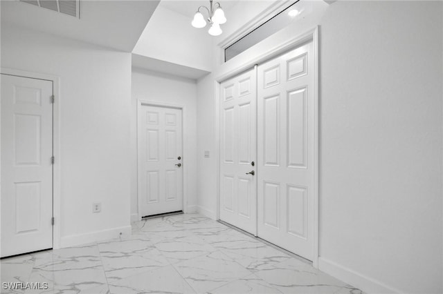 corridor with a chandelier