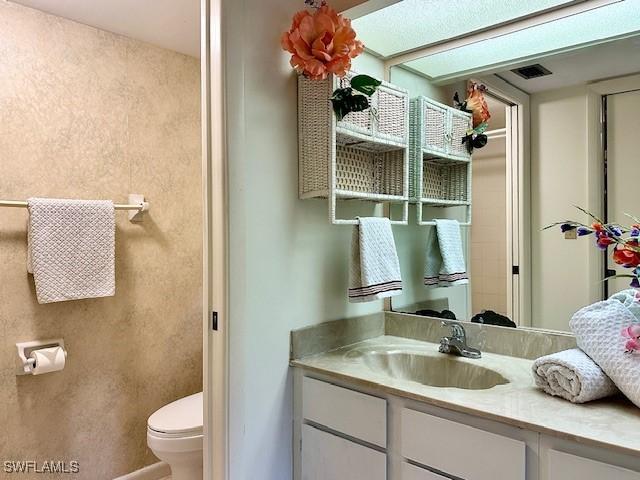 bathroom with vanity and toilet