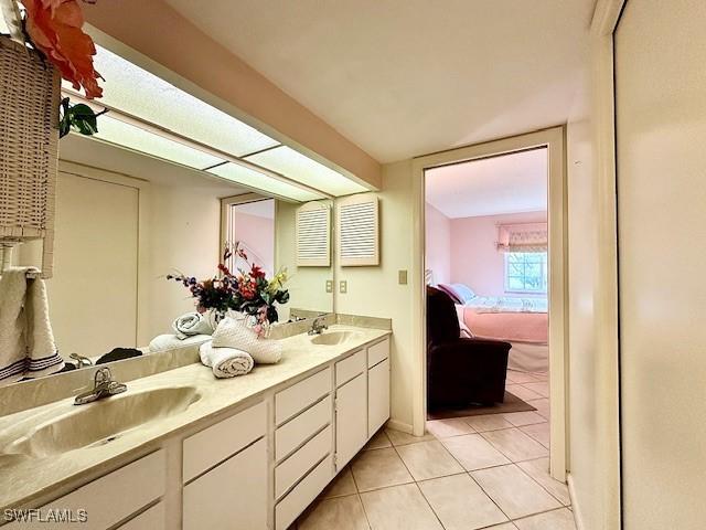 bathroom with vanity and tile patterned floors