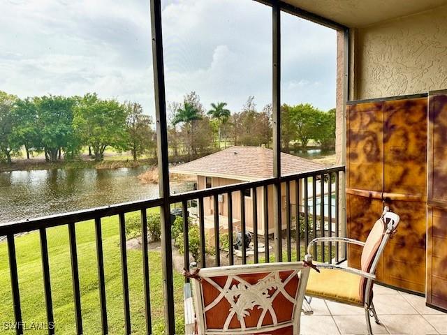 balcony featuring a water view