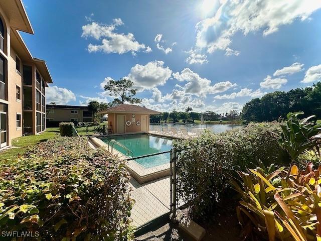 view of pool with a water view