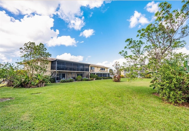 355 Palm Dr Unit 1, Naples, FL 34112 - view of grassy yard with a sunroom