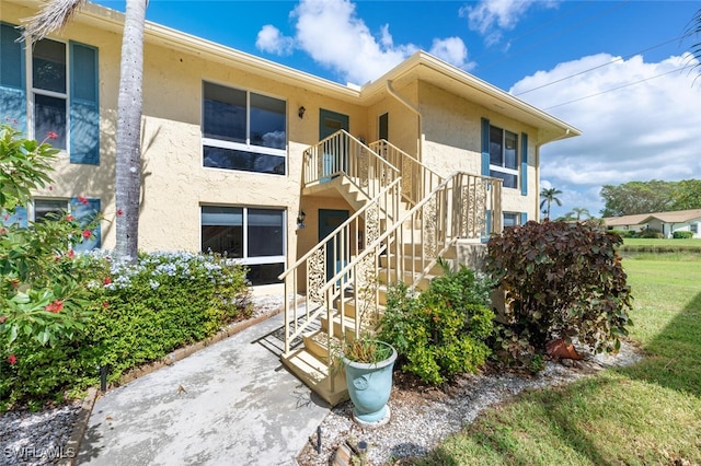 355 Palm Dr Unit 1, Naples, FL 34112 - view of property featuring stairway
