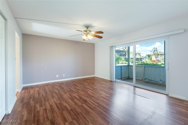 unfurnished room featuring ceiling fan and dark wood-type flooring