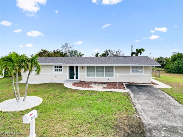 single story home with a front yard