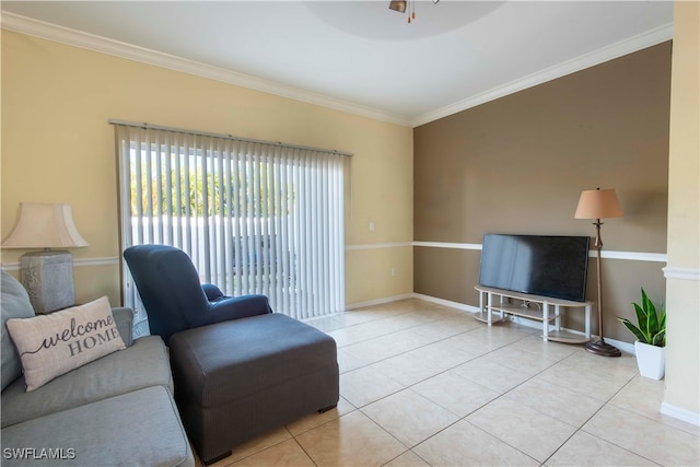 tiled living room featuring ceiling fan and ornamental molding