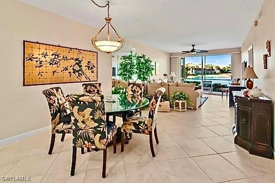 dining area with ceiling fan and light tile patterned floors