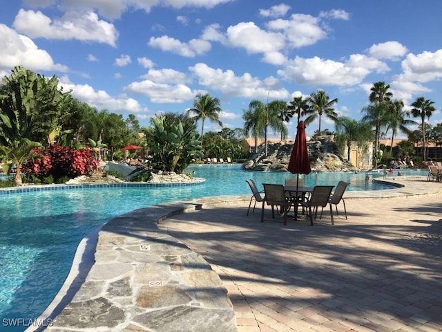 view of swimming pool with a patio