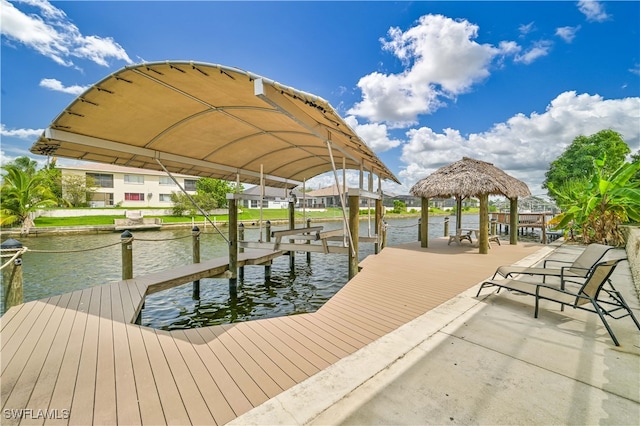 dock area featuring a gazebo and a water view