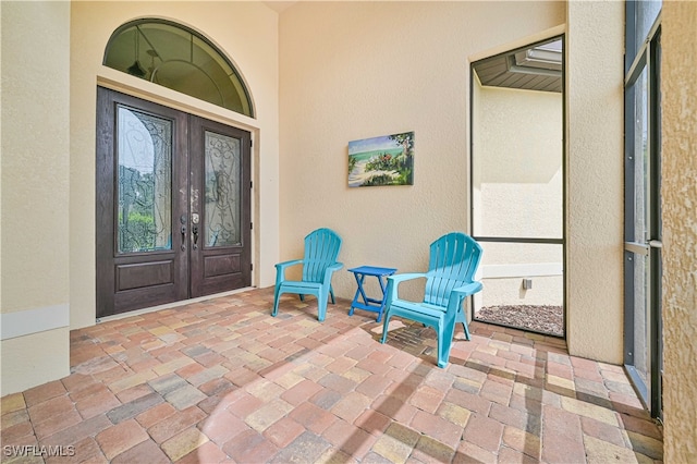 entrance to property featuring french doors