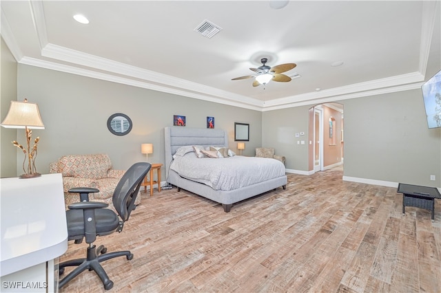 bedroom featuring ceiling fan, crown molding, and light hardwood / wood-style floors