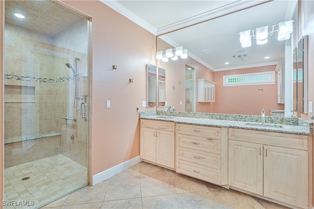 bathroom with vanity, ornamental molding, walk in shower, and tile patterned flooring