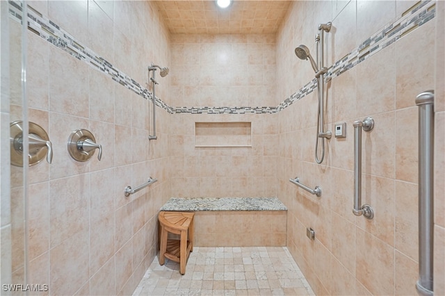 bathroom featuring a tile shower