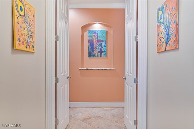 corridor with light tile patterned floors