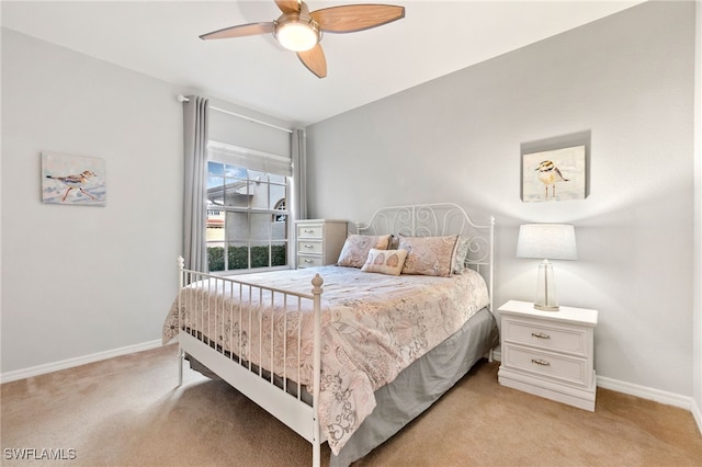 bedroom with light carpet and ceiling fan