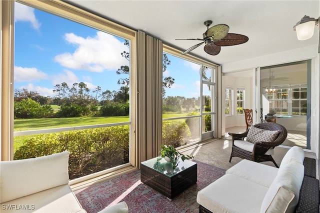 sunroom / solarium featuring ceiling fan