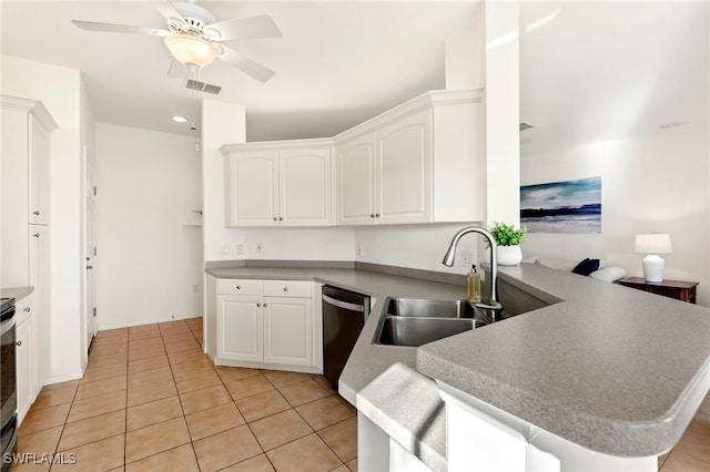 kitchen with kitchen peninsula, white cabinetry, light tile patterned floors, and stainless steel appliances