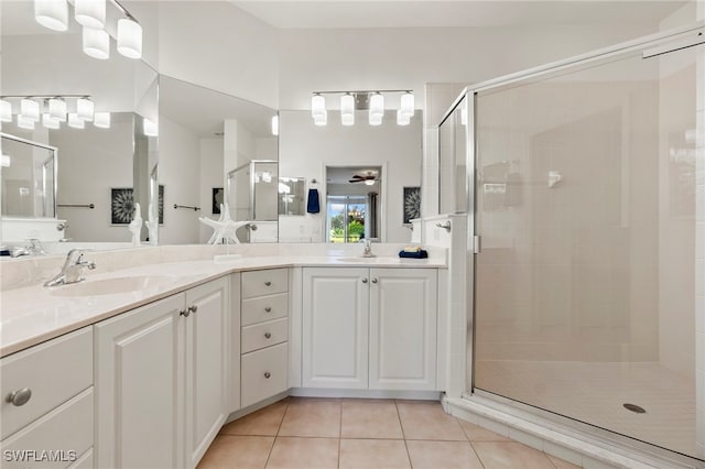 bathroom with tile patterned flooring, vanity, ceiling fan, and a shower with shower door