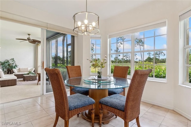 20301 E Calice Ct Unit 2002, Estero, FL 33928 - dining room with a chandelier, baseboards, and light tile patterned floors