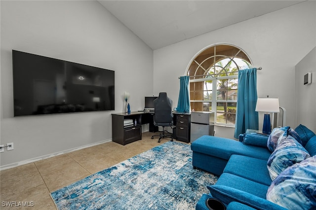 home office with light tile patterned flooring and high vaulted ceiling