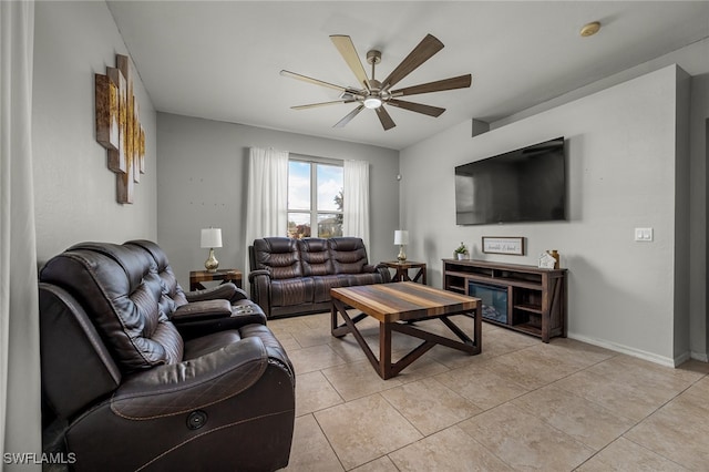 tiled living room featuring ceiling fan