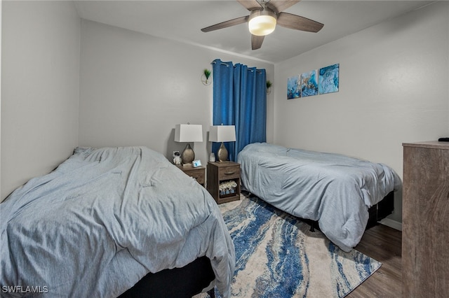 bedroom featuring ceiling fan and hardwood / wood-style flooring