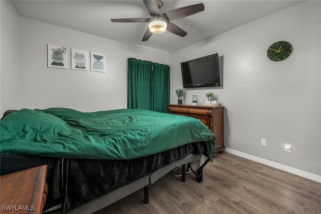 bedroom featuring ceiling fan and wood-type flooring