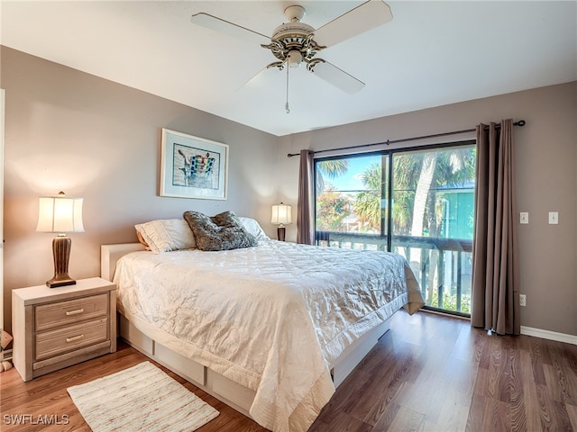 bedroom with access to outside, dark wood-type flooring, and ceiling fan