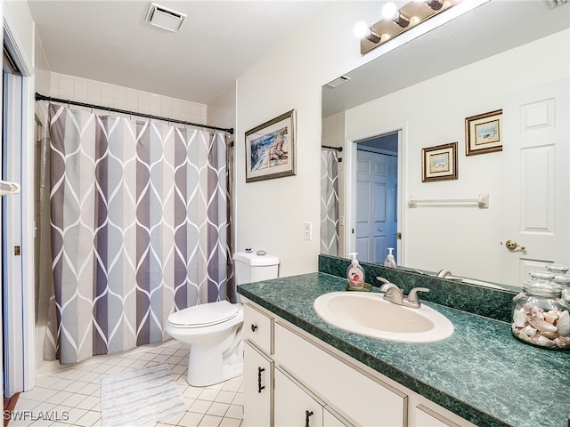 bathroom with tile patterned floors, vanity, and toilet