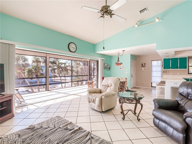 tiled living room featuring high vaulted ceiling and ceiling fan