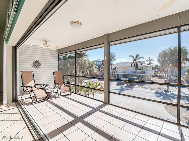 sunroom / solarium with ceiling fan