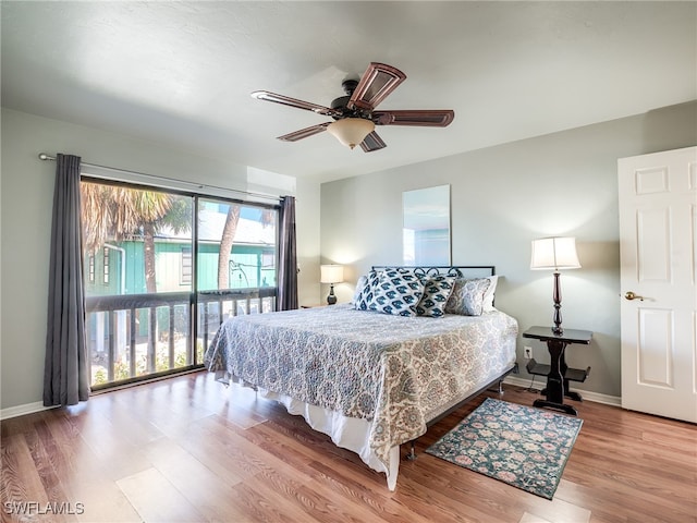 bedroom with wood-type flooring and ceiling fan