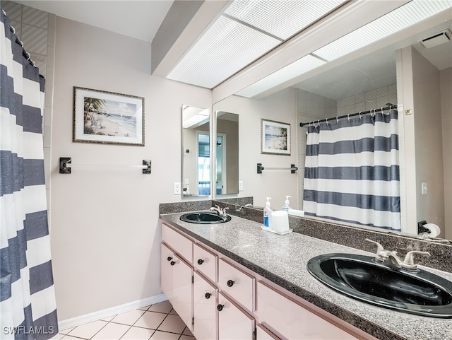 bathroom featuring a shower with curtain, vanity, and tile patterned floors