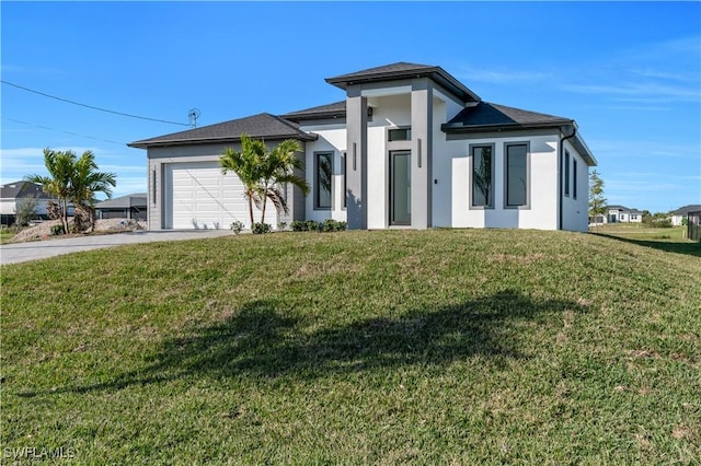 view of front facade featuring a garage and a front yard