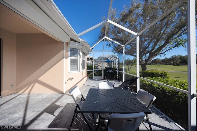 view of patio / terrace with glass enclosure