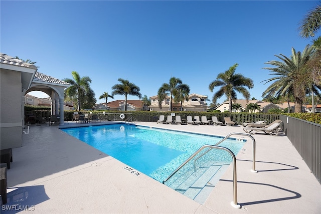 view of swimming pool featuring a patio area