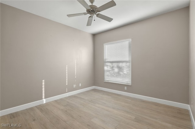 spare room featuring ceiling fan and light wood-type flooring