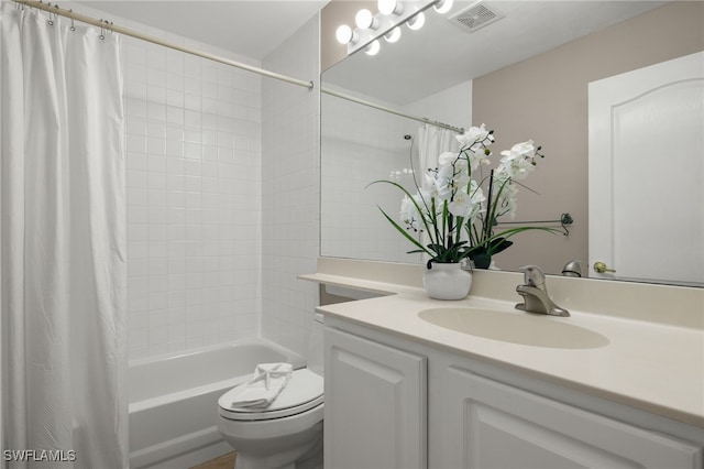 full bathroom with vanity, shower / bath combo with shower curtain, and toilet