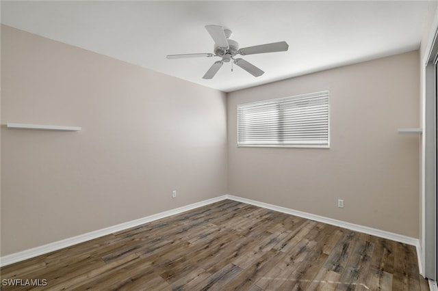 3517 Heron Glen Ct, Bonita Springs, FL 34134 - spare room featuring wood finished floors, baseboards, and a ceiling fan