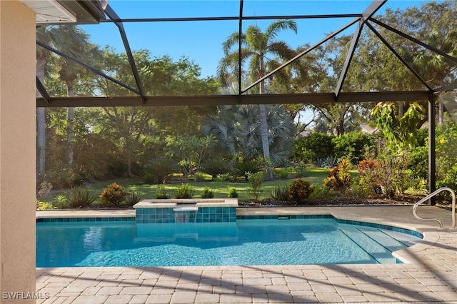 view of swimming pool featuring a patio and a lanai