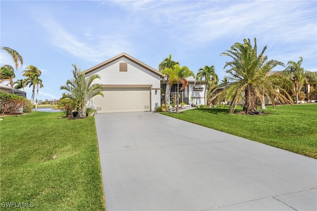 ranch-style house featuring a front yard and a garage