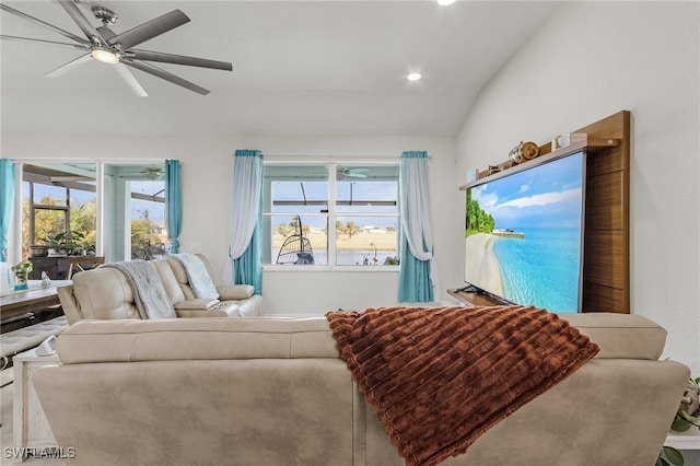 living room with lofted ceiling, a water view, and ceiling fan