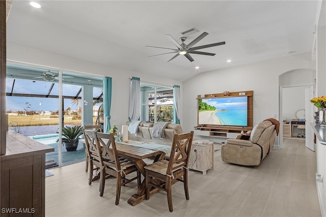 dining area with lofted ceiling, light hardwood / wood-style flooring, and ceiling fan