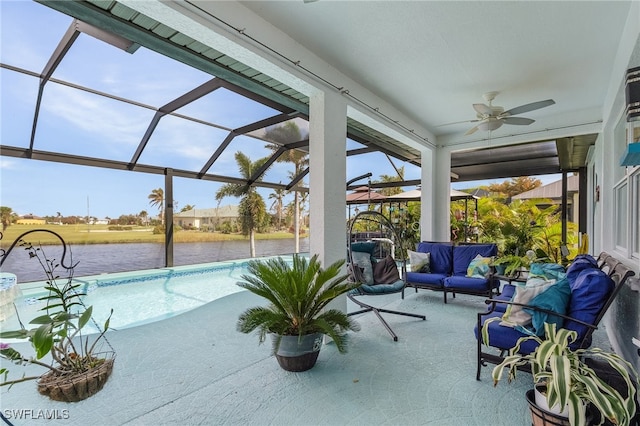 exterior space featuring a patio, a lanai, a water view, and ceiling fan