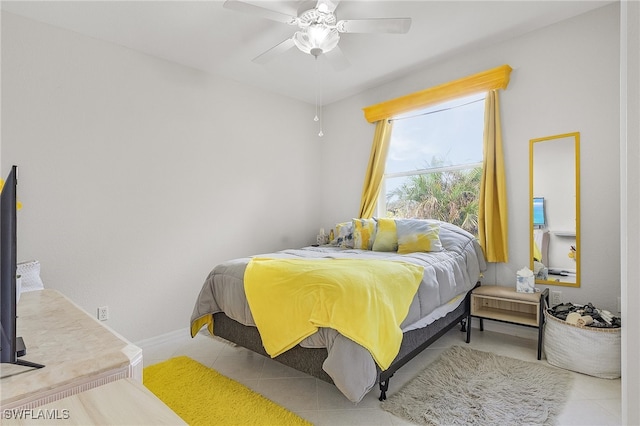 bedroom featuring ceiling fan and light tile patterned floors