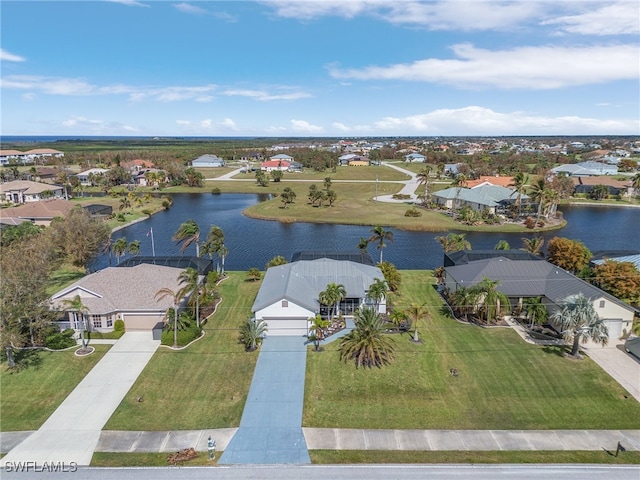 birds eye view of property with a water view