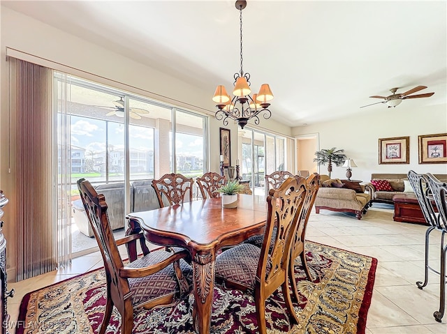 dining space with light tile patterned floors and ceiling fan with notable chandelier