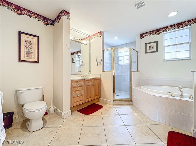 full bathroom featuring vanity, tile patterned flooring, shower with separate bathtub, and toilet